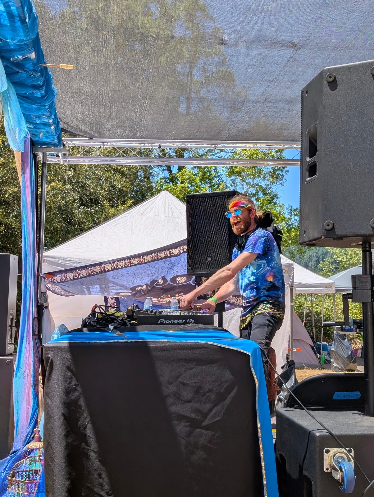 DJ R3$pecht performing an outdoor stage set at Summer Arts & Music Festival