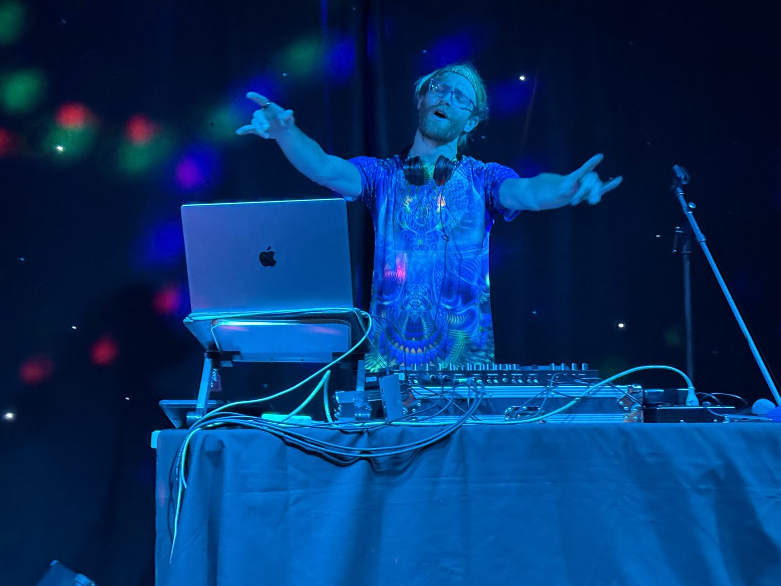 DJ R3$pecht performing at the Blue Lake Wave Lounge under blue stage lighting